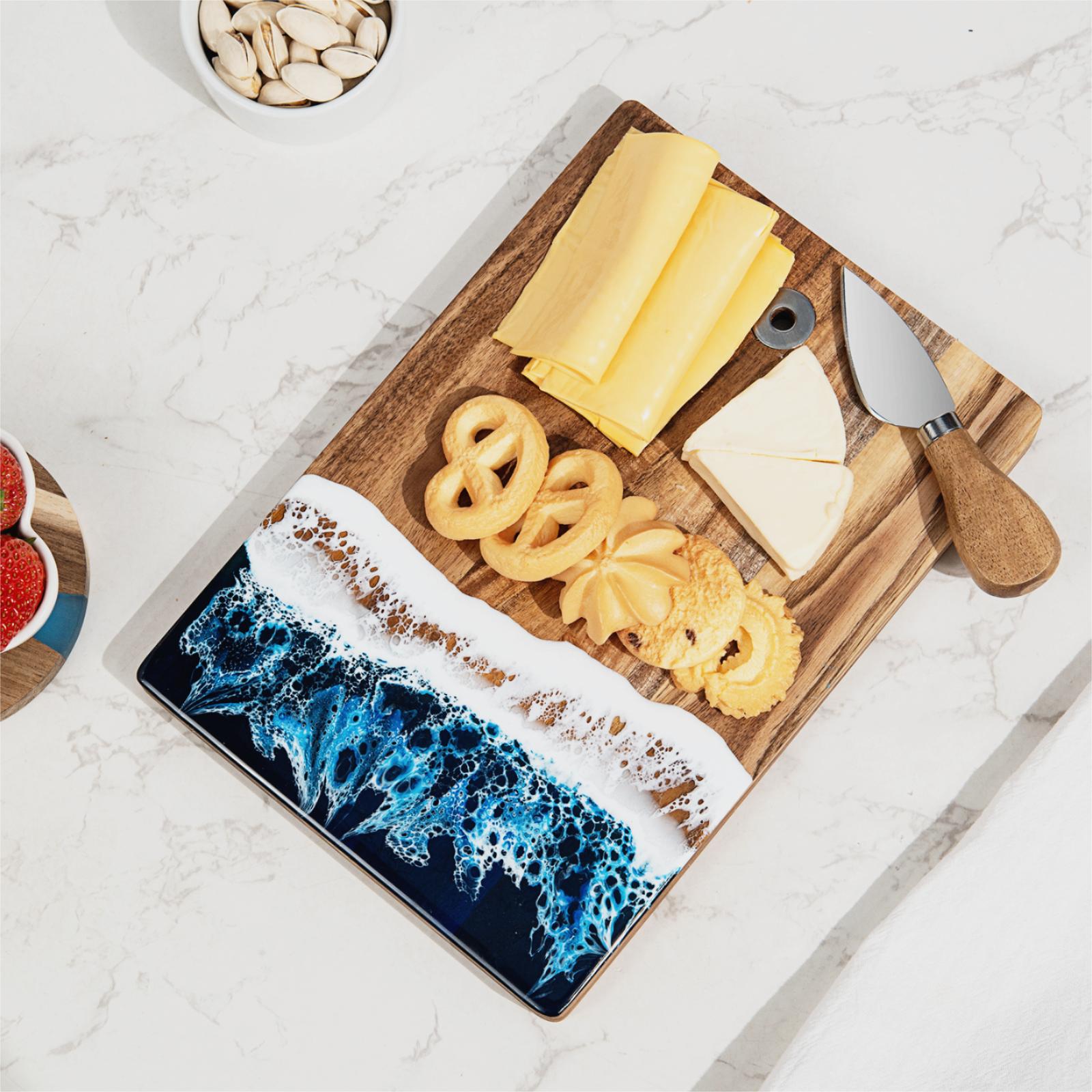 Blue resin cutting with cheese and resin cheese knives on it