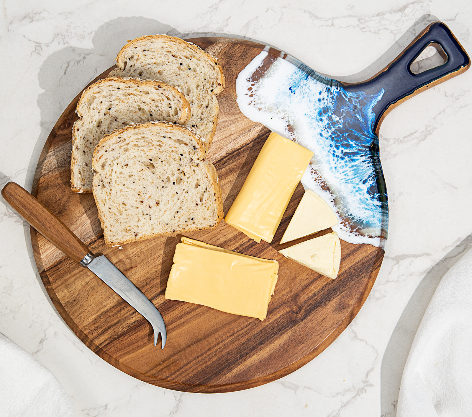 Round acacia wood and epoxy resin charcuterie board for cheese fruit desserts and ocean style serving