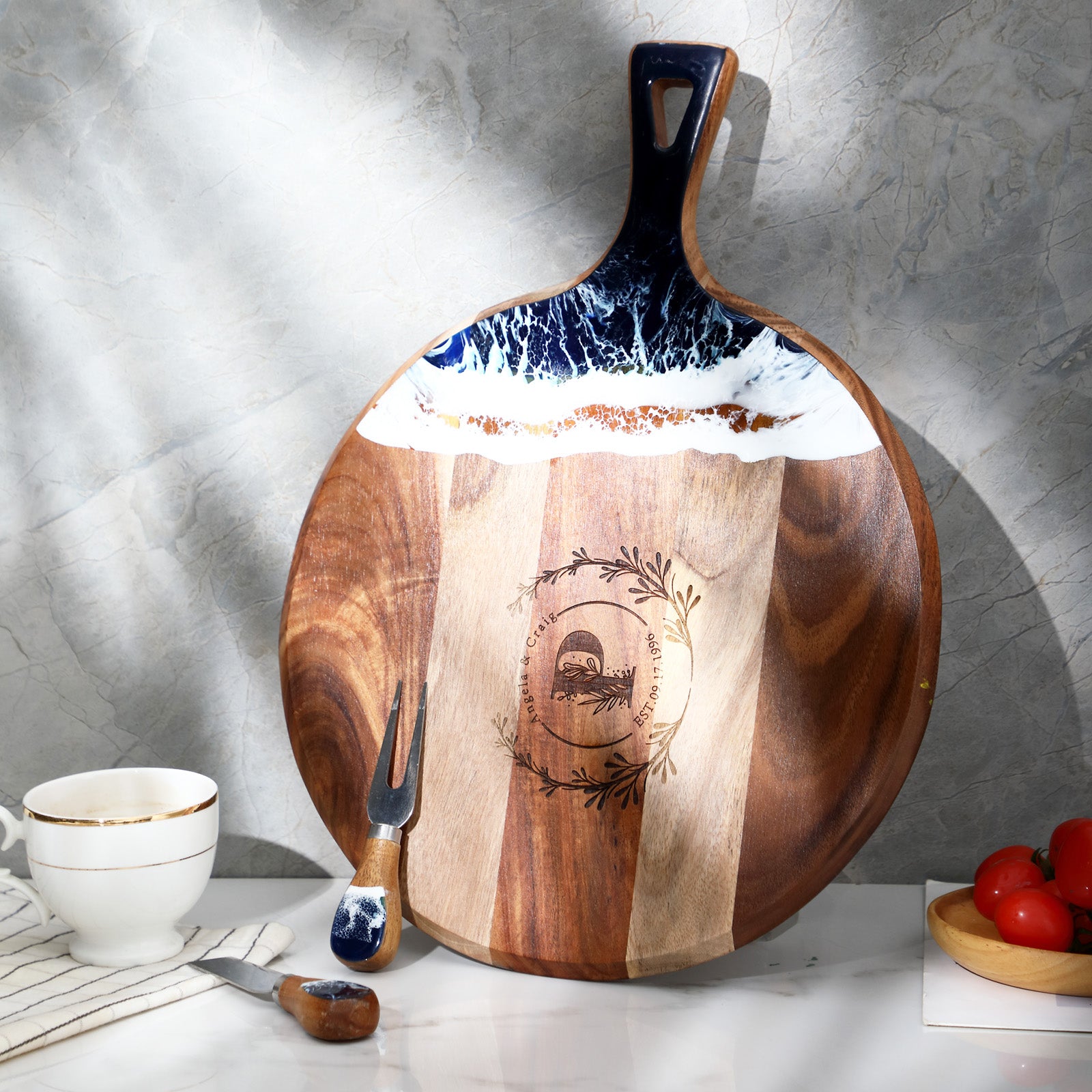 Custom engraved round resin cutting board displayed on a kitchen counter