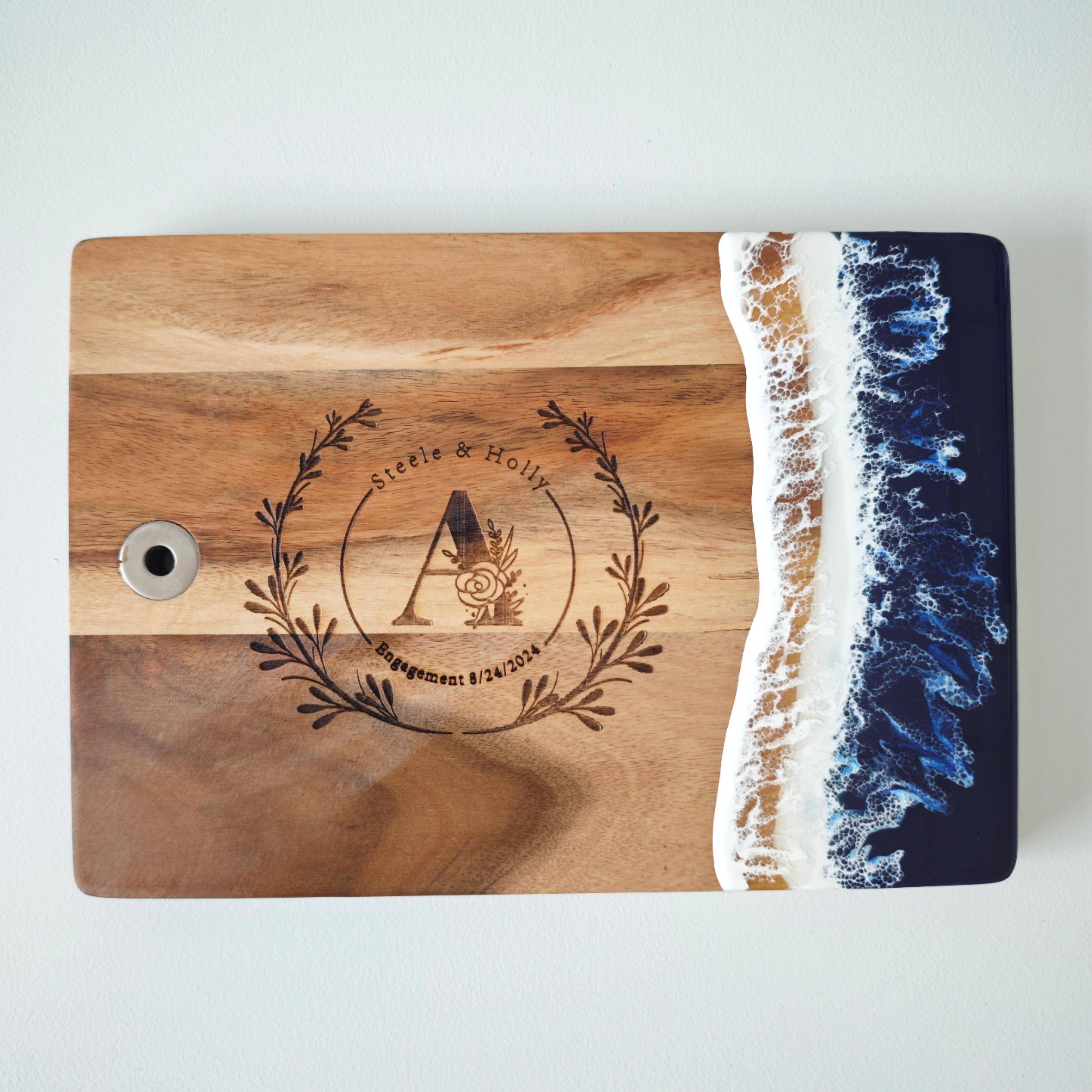 Acacia wood resin chopping board hanging on kitchen wall as decor